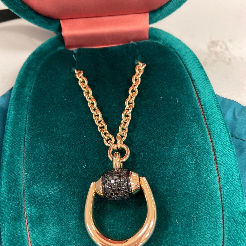 Gucci 14k rose gold with black diamonds pendant.